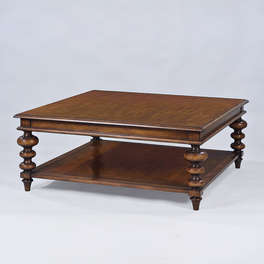 Square walnut coffee table, detailed turned legs, studio light.