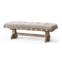 Rustic trestle style upholstered bench on white background.