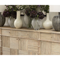 Decor items on rustic washed buffet sideboard.