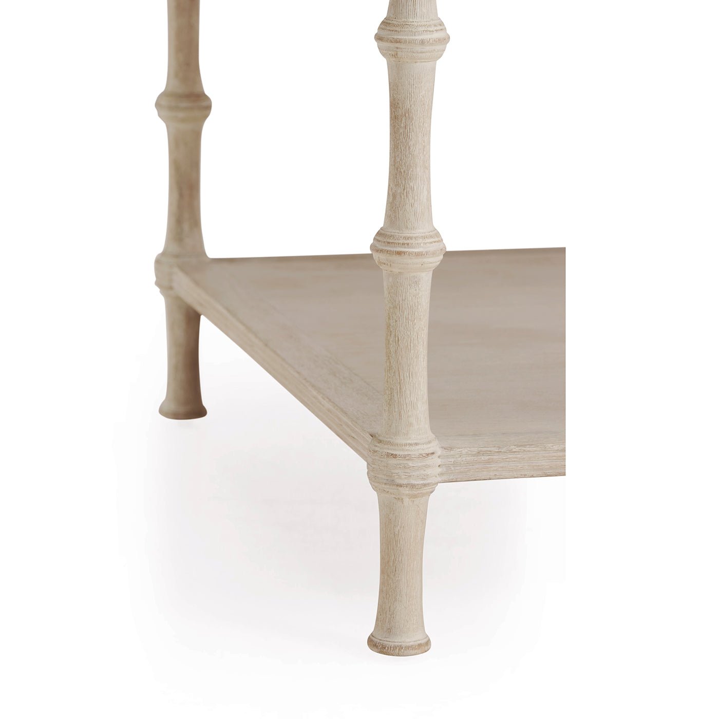 Close-up of rustic washed coffee table lower shelf and leg.