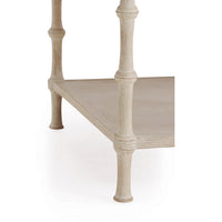 Close-up of rustic washed coffee table lower shelf and leg.