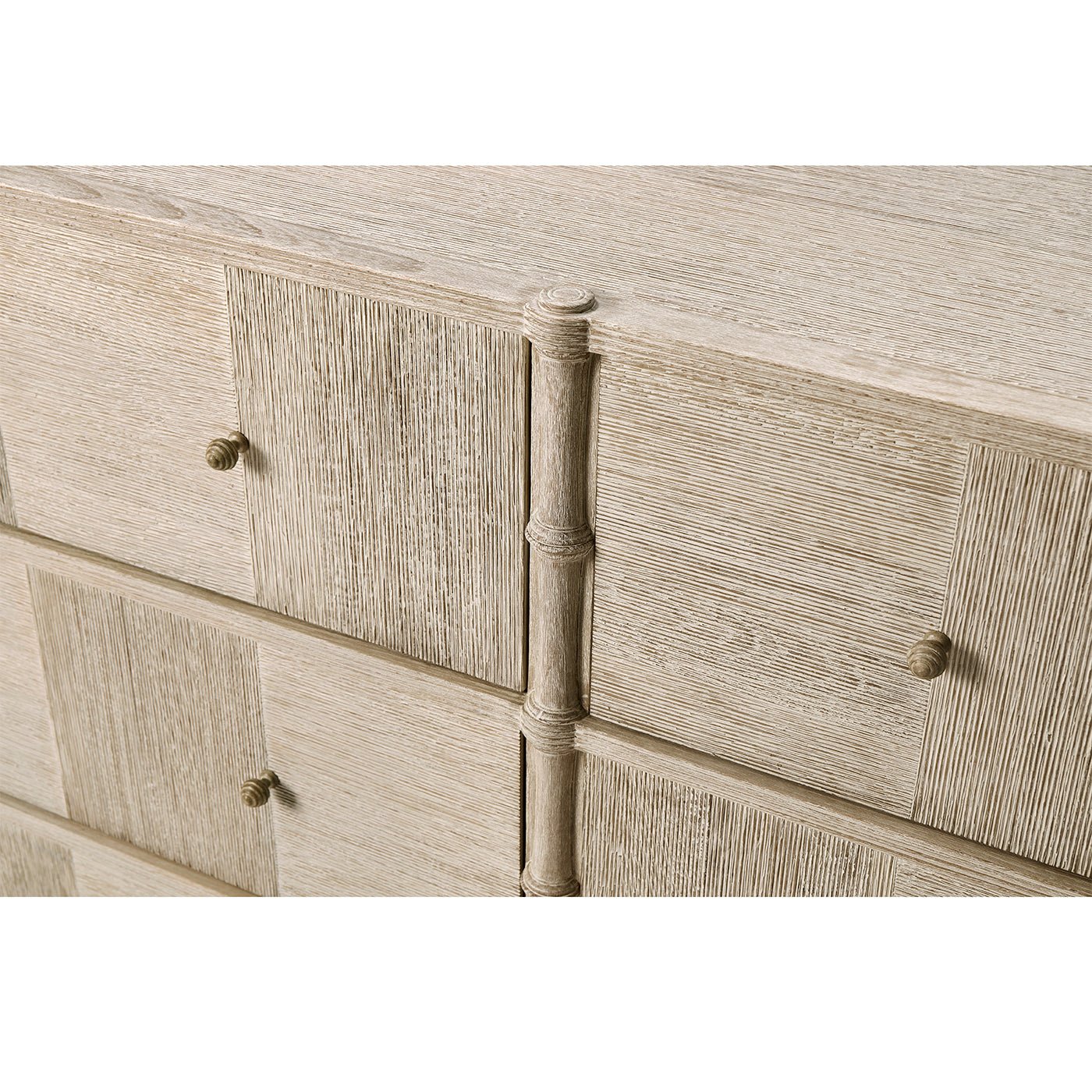 Rustic washed dresser, close-up, central column and drawer knobs.