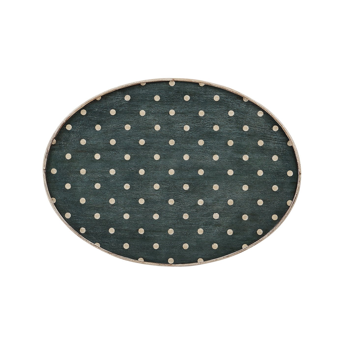 Close-up of polka dot top on oval end table.
