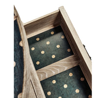 Open drawer interior of rustic washed oval end table.