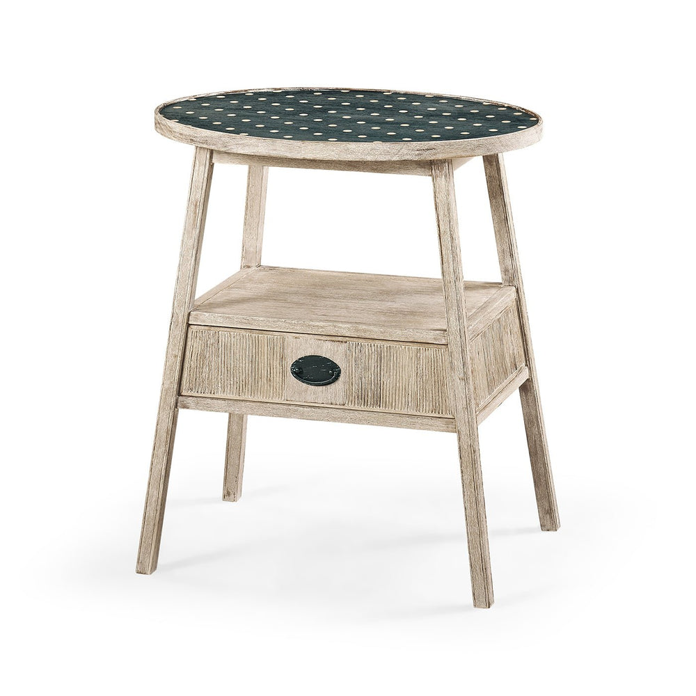 Rustic washed oval end table with polka dot top.