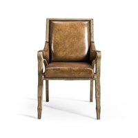 Rustic leather armchair, straight-on front view.