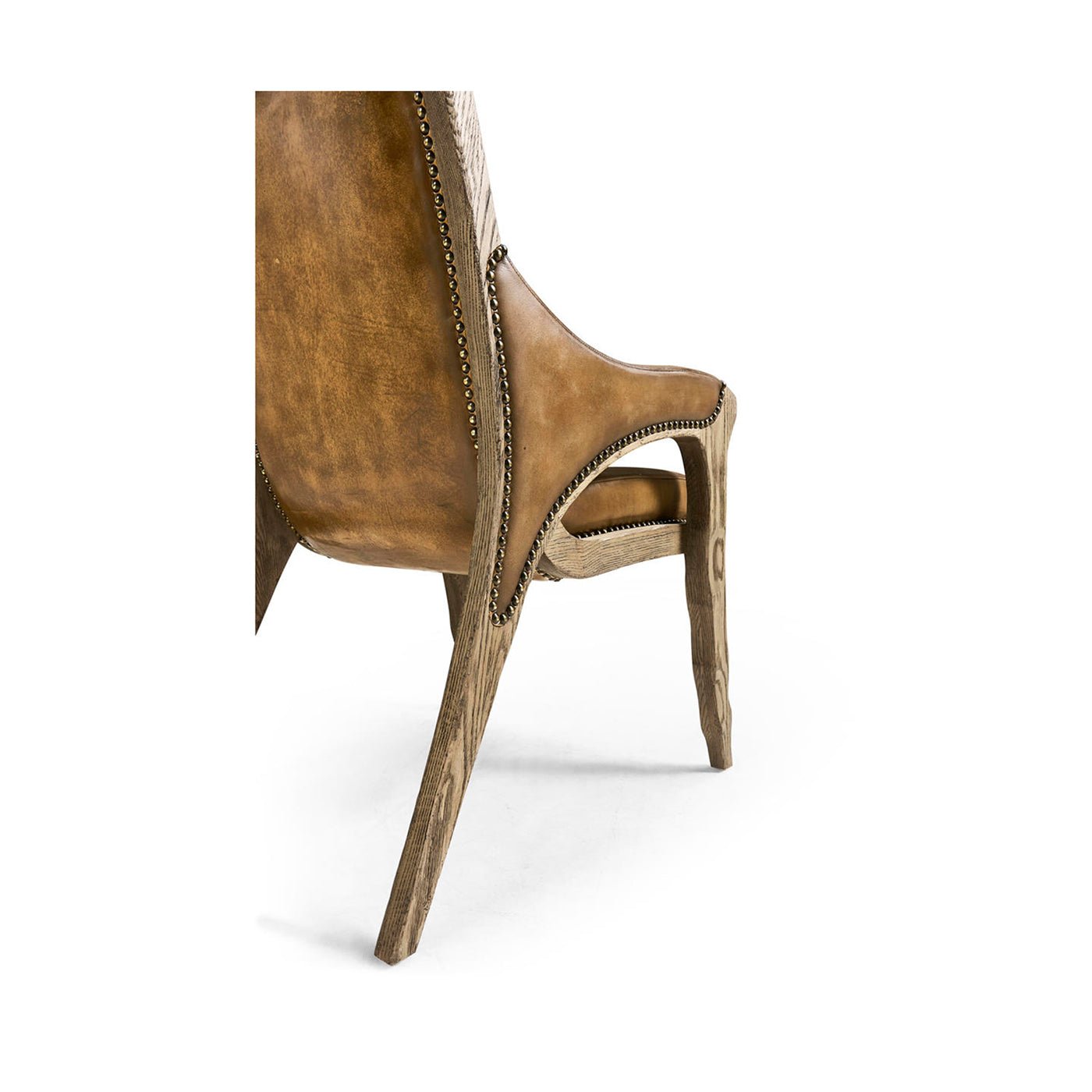 Rustic leather armchair, back and leg side detail.