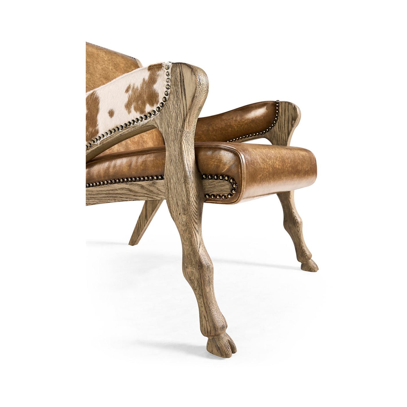 Detailed view of leather chair's wooden hooved legs.