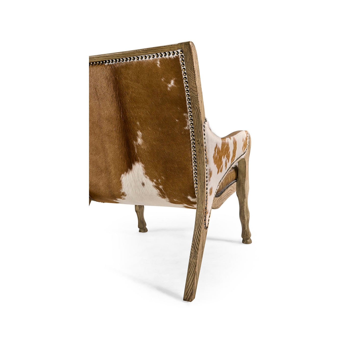 Rear angle of cowhide leather accent chair and legs.