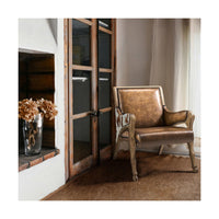 Leather accent chair in rustic living room setting.