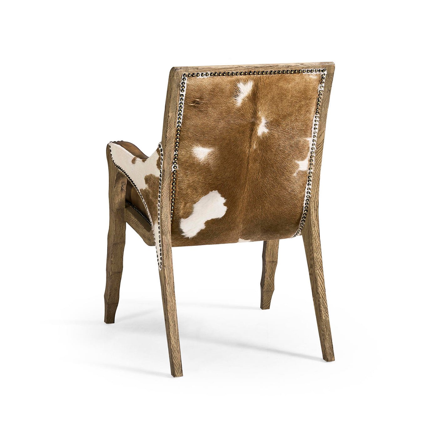 Rustic armchair back view with cowhide pattern.