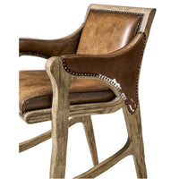 Rustic Western bar stool, armrest and seat detail.