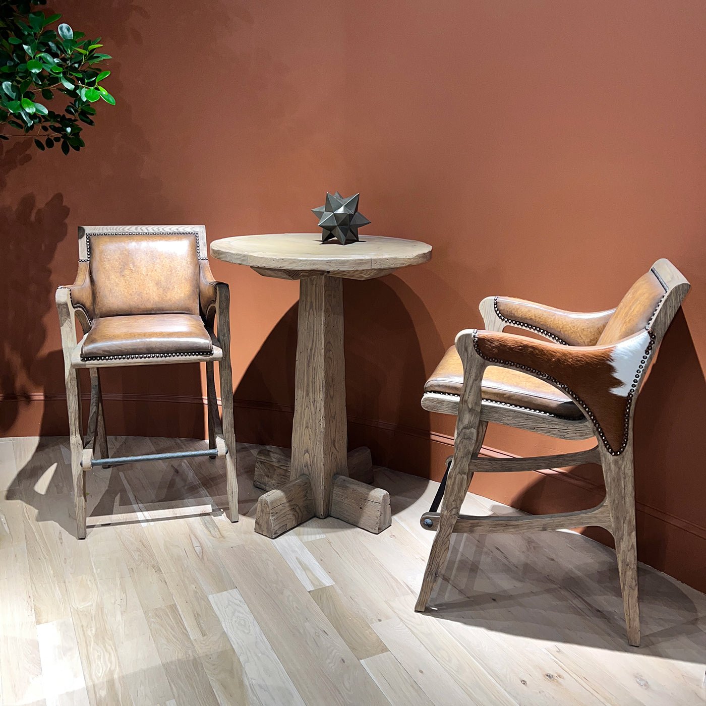 Rustic Western bar stool set, table, and decor scene.