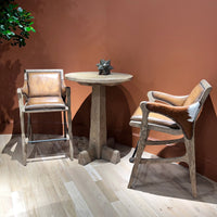 Rustic Western bar stool set, table, and decor scene.