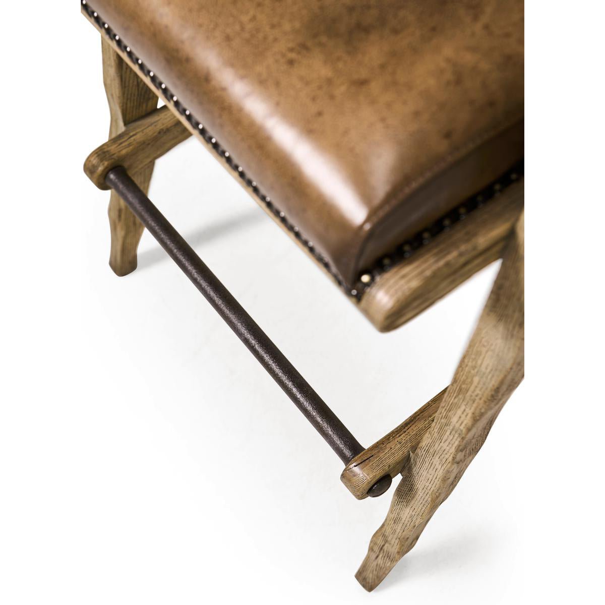 Rustic Western bar stool, footrest and seat close-up.