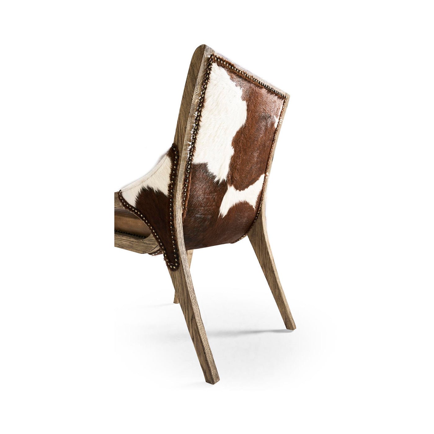 Rustic chair back curve showing cowhide and wood frame.