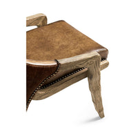Close-up of rustic chair seat and wooden frame detail.