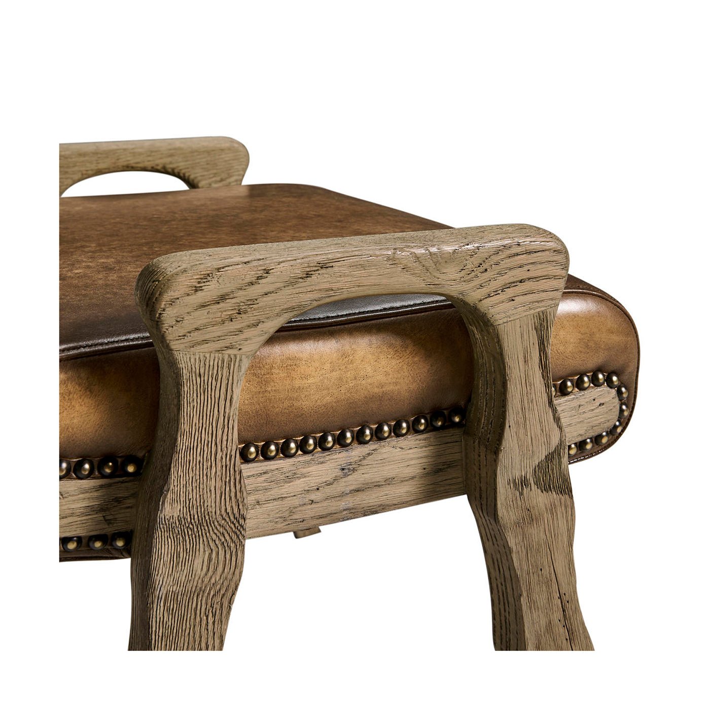 Arm detail of the rustic leather upholstered footstool.