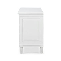 Side view of white nightstand showing panel design.
