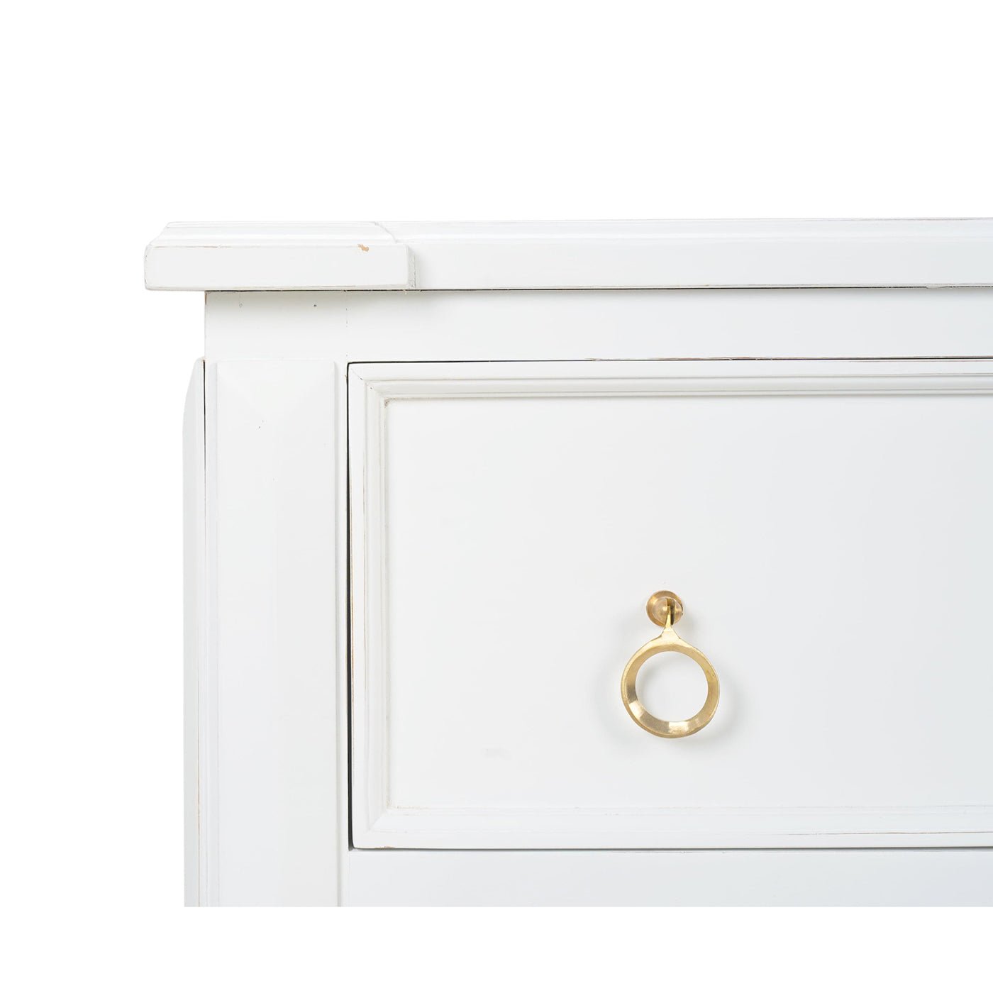 Close-up of top drawer and gold handle on dresser.