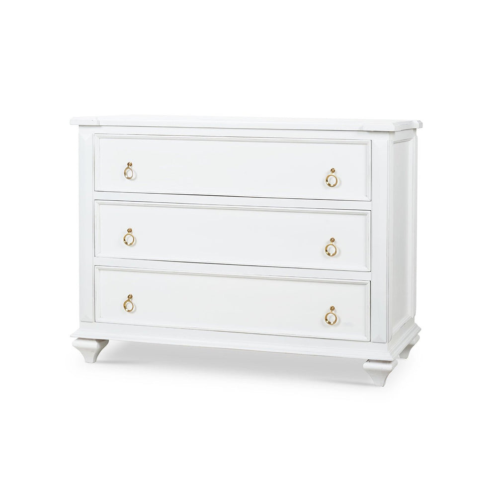 White chest of drawers, angled view with three handles.