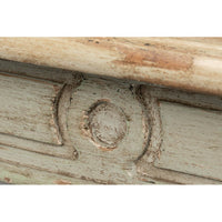 Rustic dining table, close-up of carved decoration.