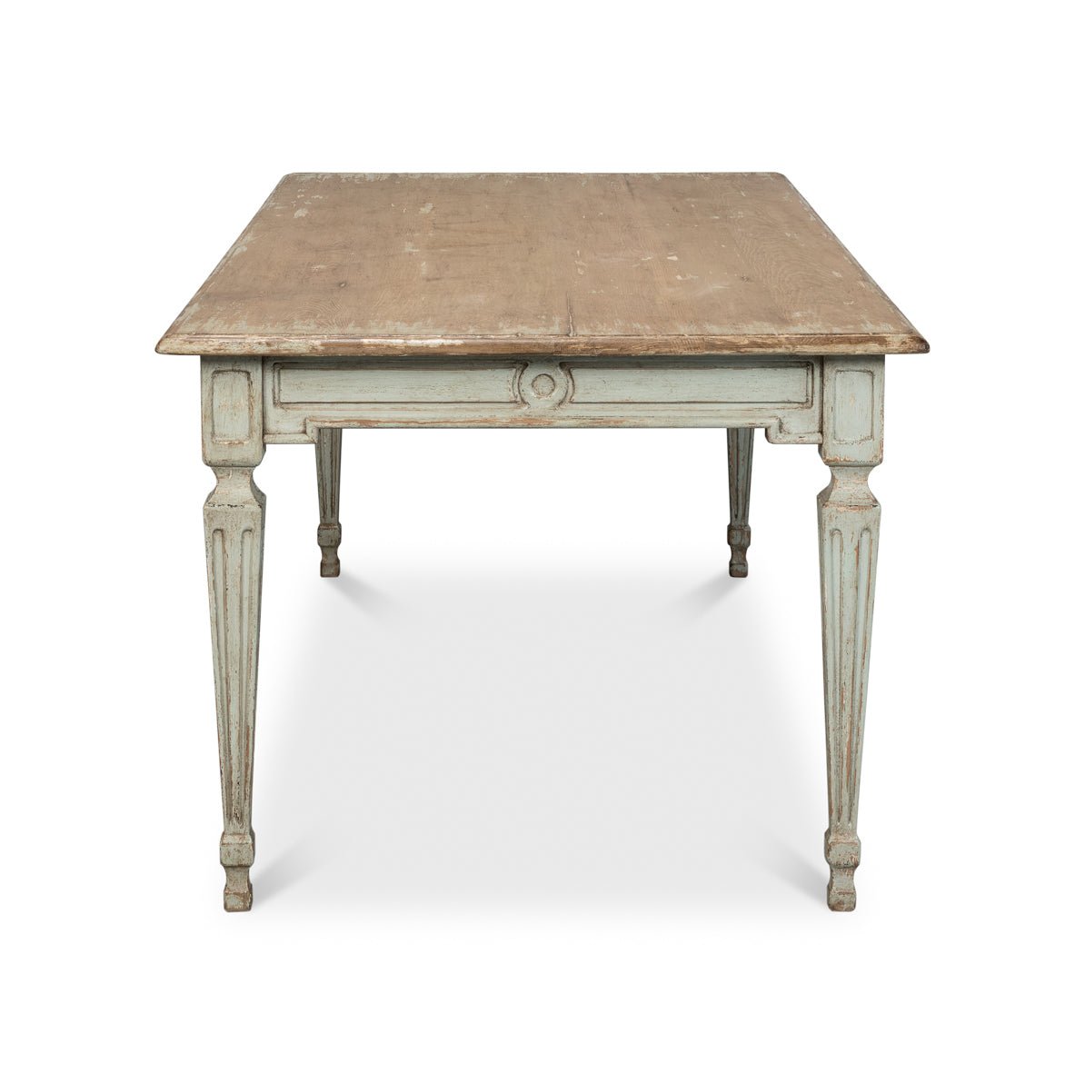 Rustic dining table, end view, carved details.