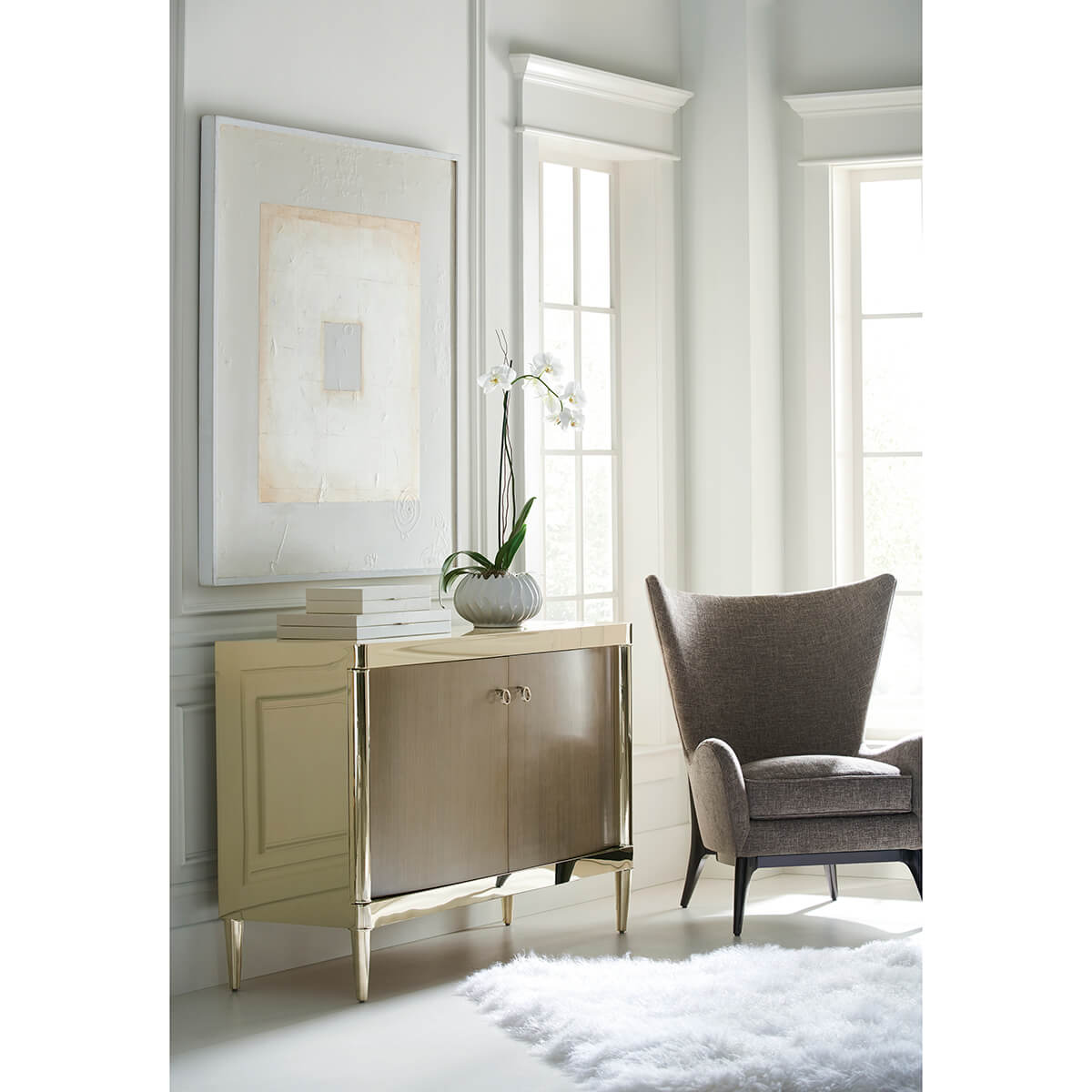 Scandinavian Mid Century Armchair in bright room with artwork.