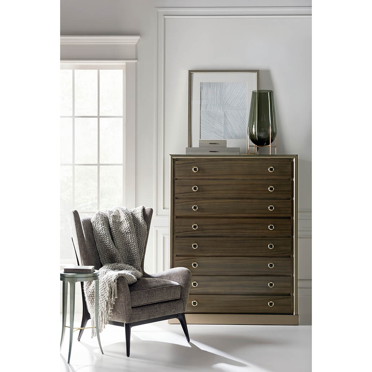 Scandinavian Mid Century Armchair with blanket by chest of drawers.