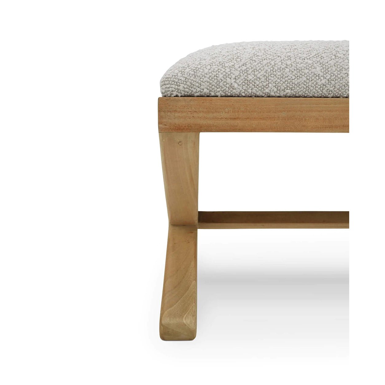 Close-up of wooden bench leg and upholstered seat.