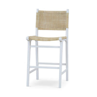 Rattan counter stool with white frame, angled view.