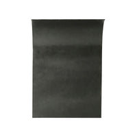 Side view of sculptural modern table, black surface.