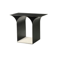 Black sculptural modern side table, angled view.