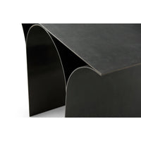 Close-up edge and curve details, modern side table.