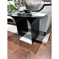 Close-up of side table with decor, living room.