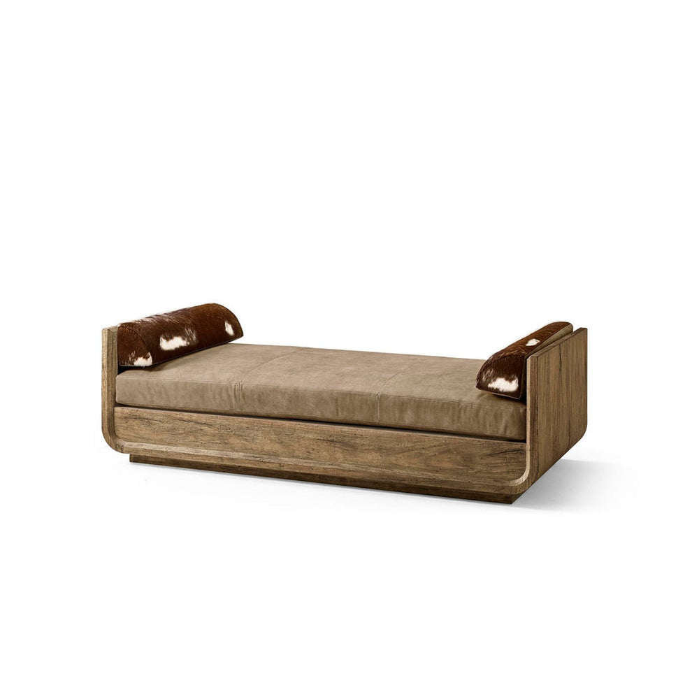 Daybed with wooden frame and bolster pillows.