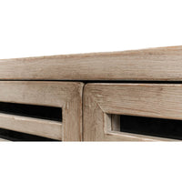 Close-up of slatted door edges on sideboard.