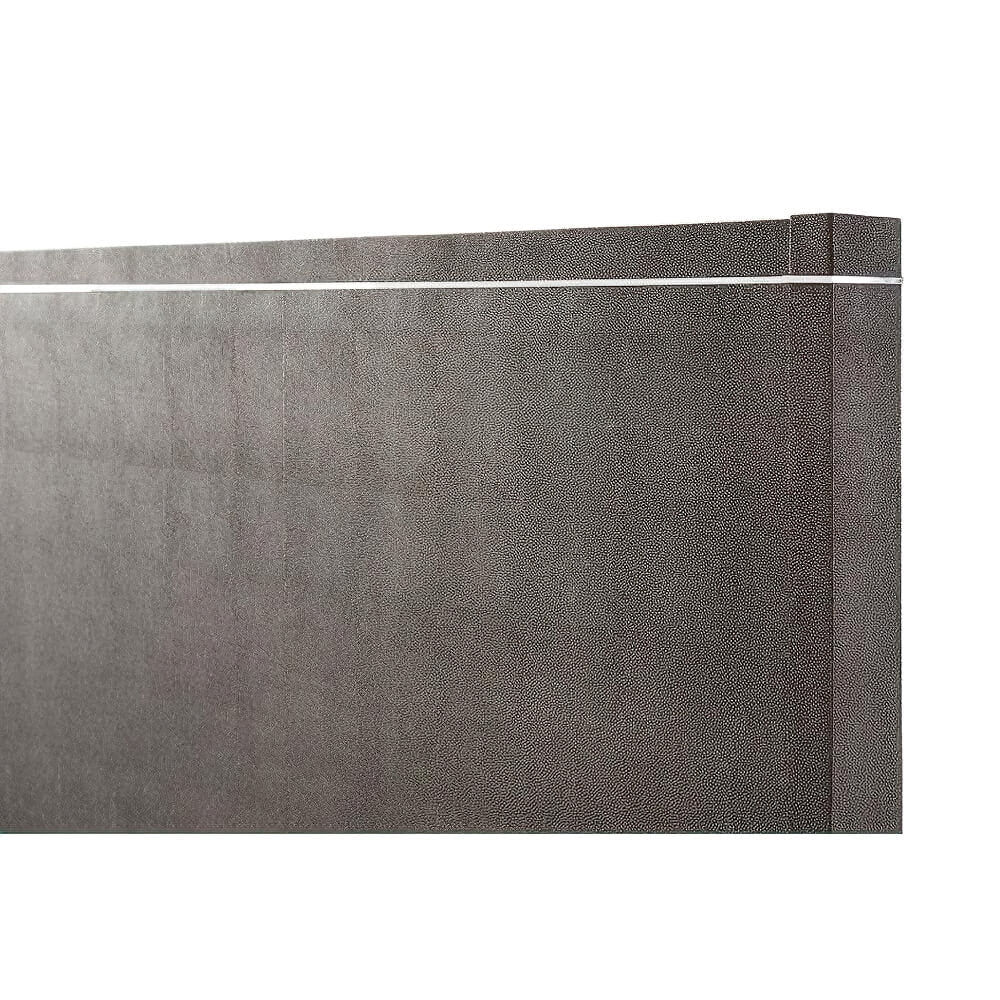 Detailed headboard texture of modern bed, close-up.