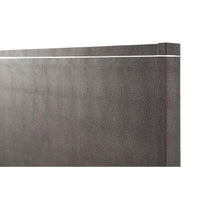 Detailed headboard texture of modern bed, close-up.