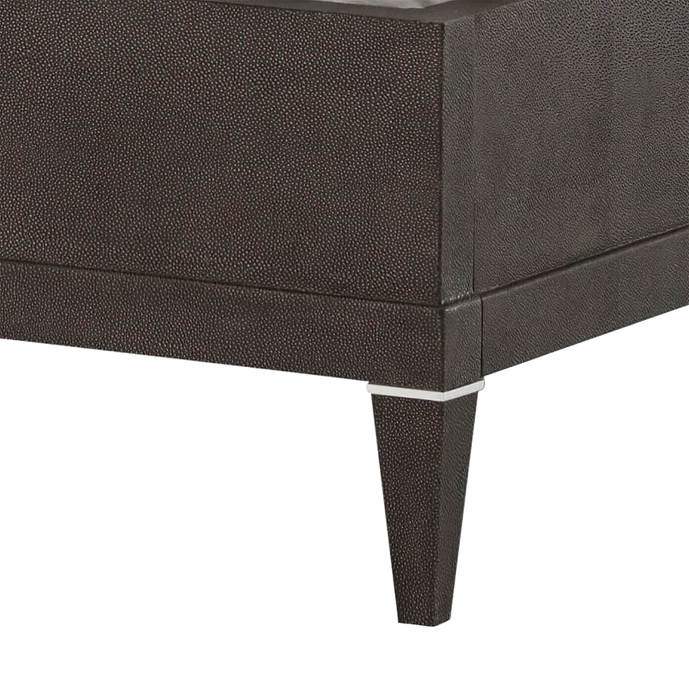 Corner view of bed leg and base detail.