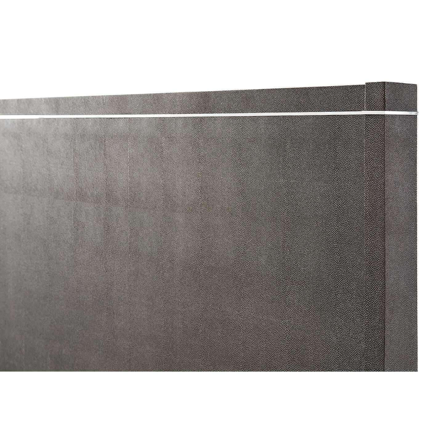 Close-up of modern bed headboard with design detail.