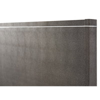 Close-up of modern bed headboard with design detail.