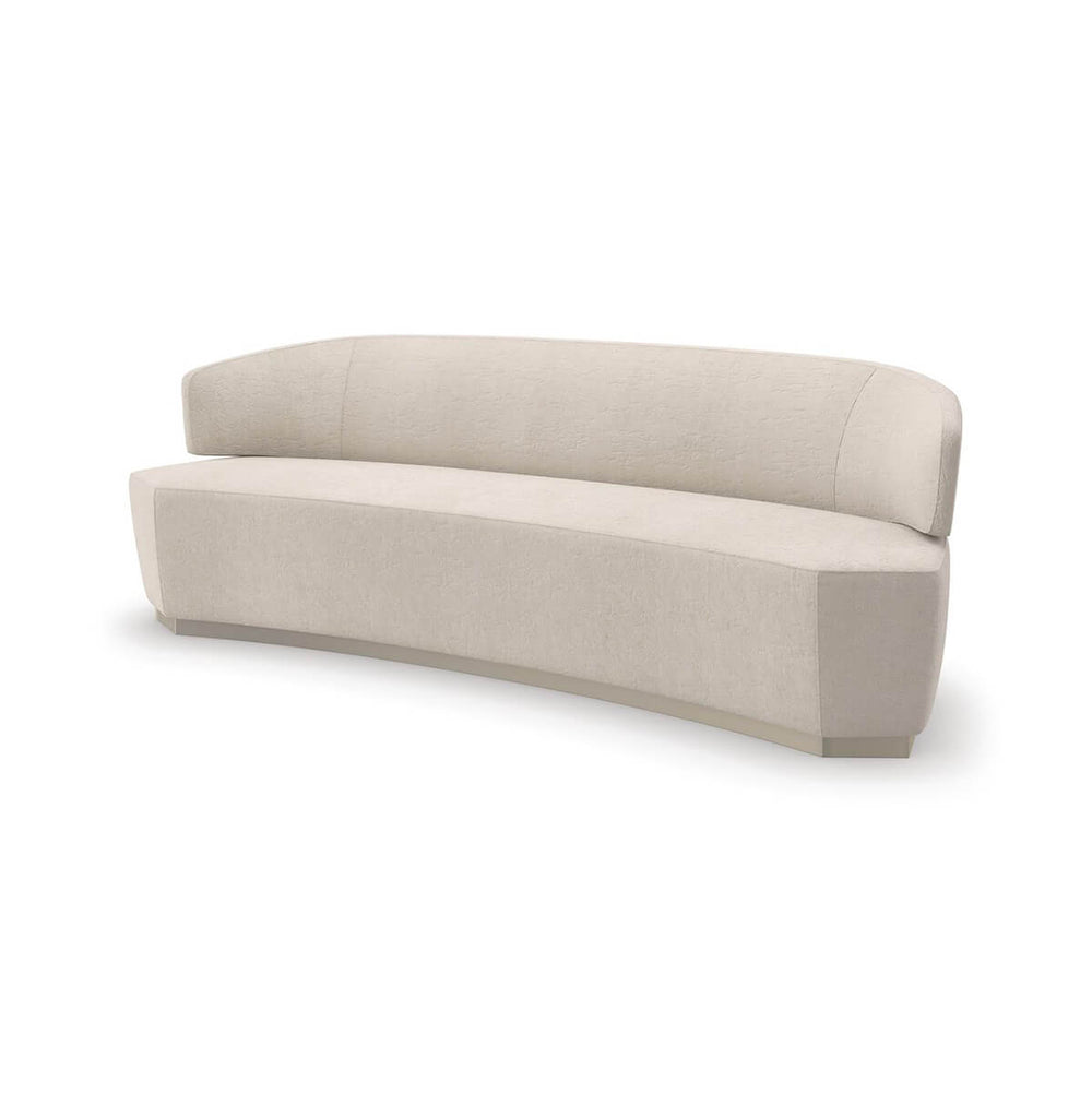 Beige curved modern sofa angled view