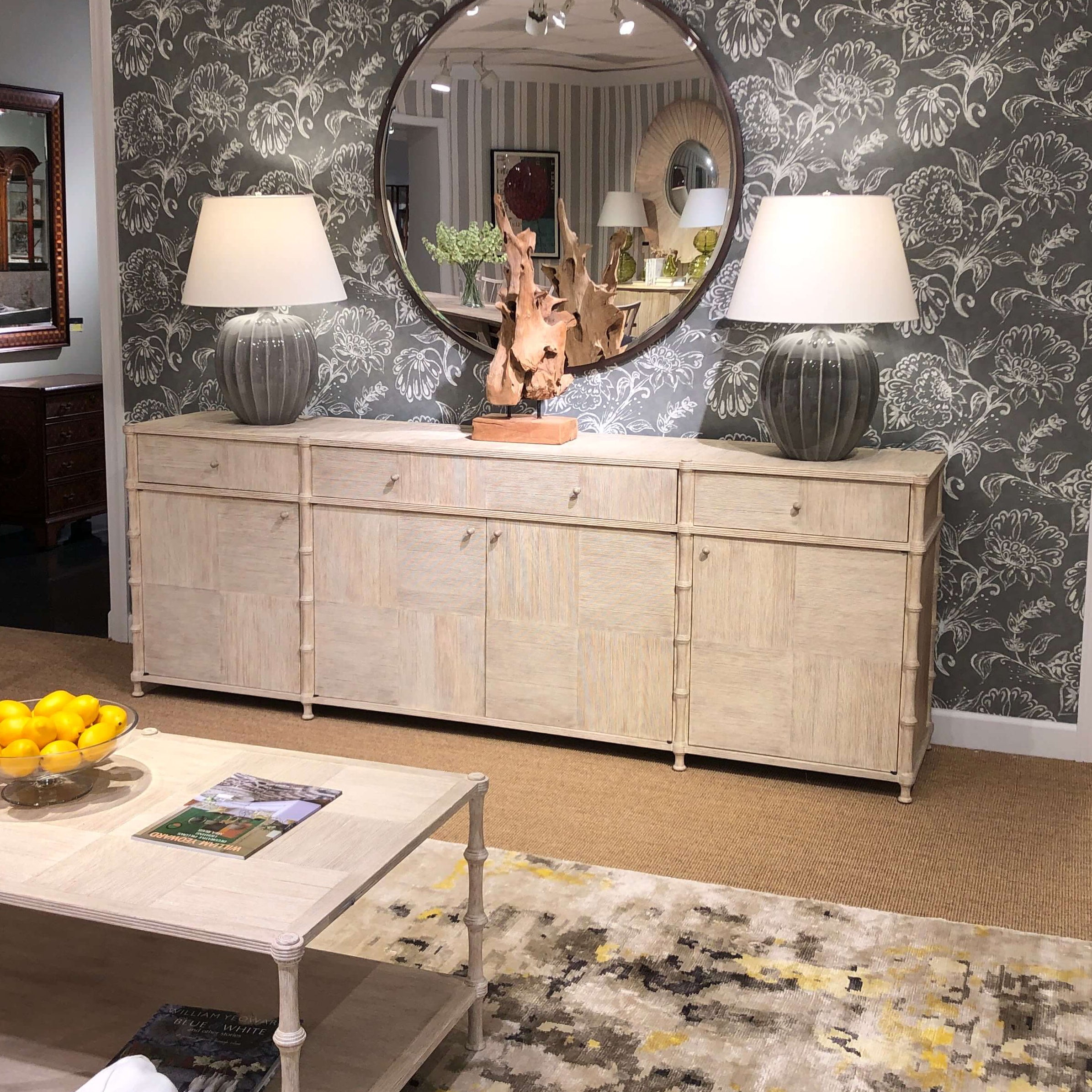 Decorated rustic washed buffet sideboard in living room.