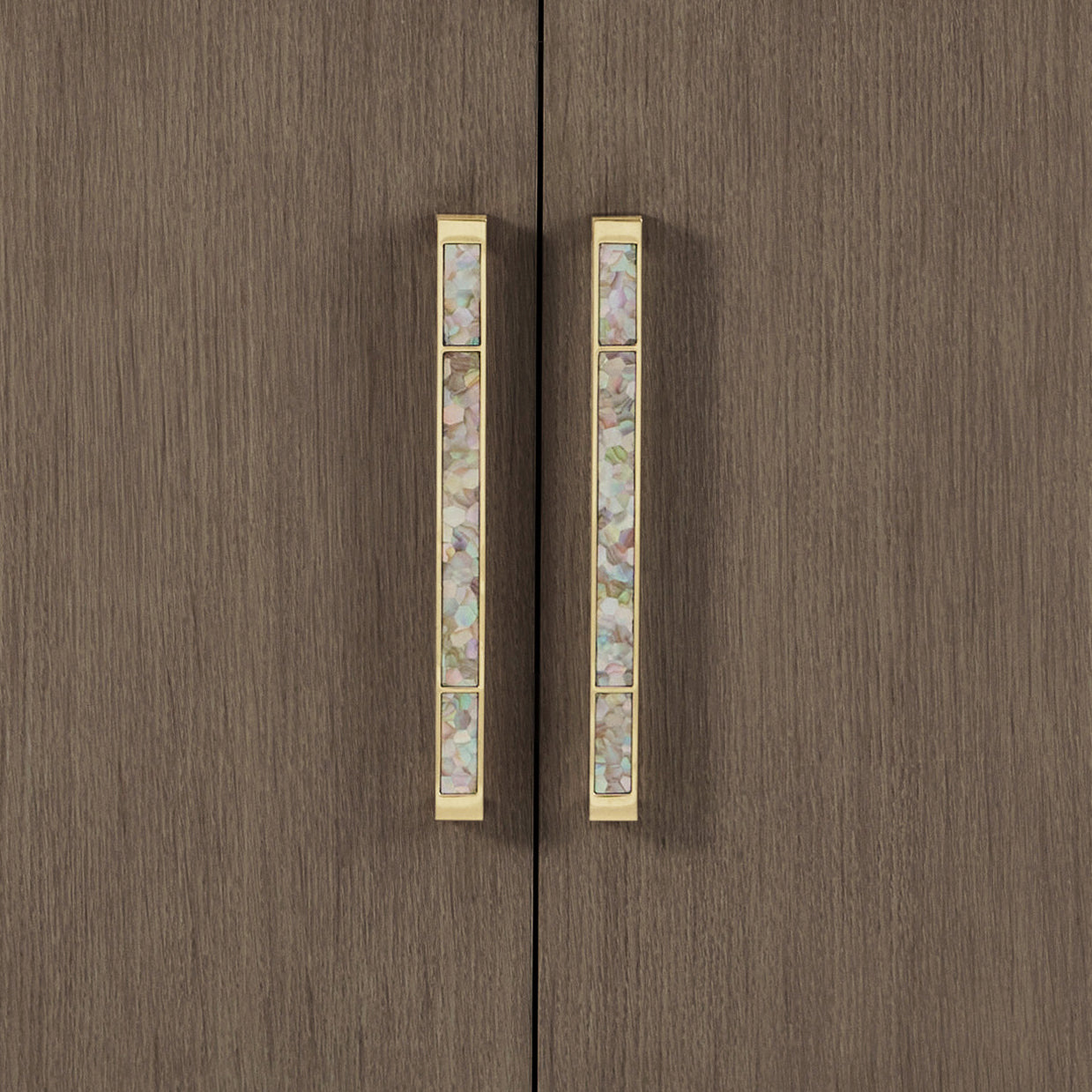 Close-up of ornate handles on sideboard buffet.