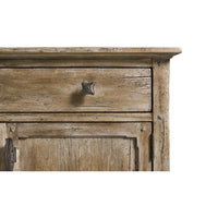 Top corner detail of sideboard with drawer handle.
