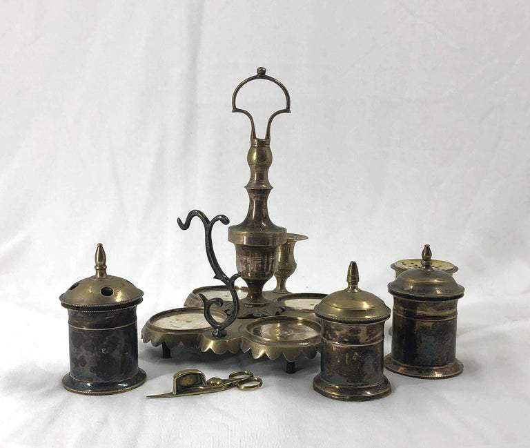 Disassembled view of silvered brass standish components.