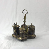 Silvered brass standish with intricate design, side angle.