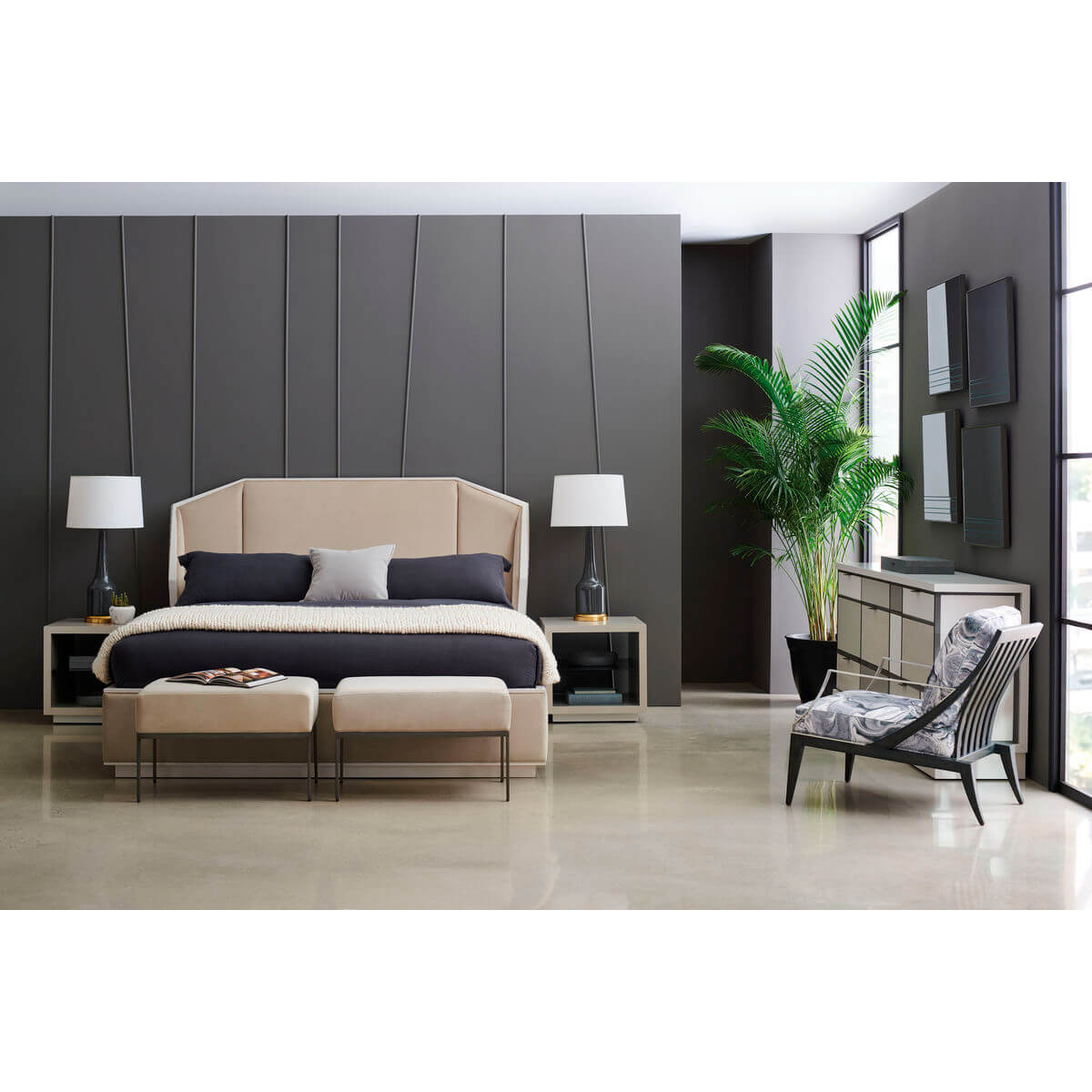 Bedroom with two modern benches at bed's foot.
