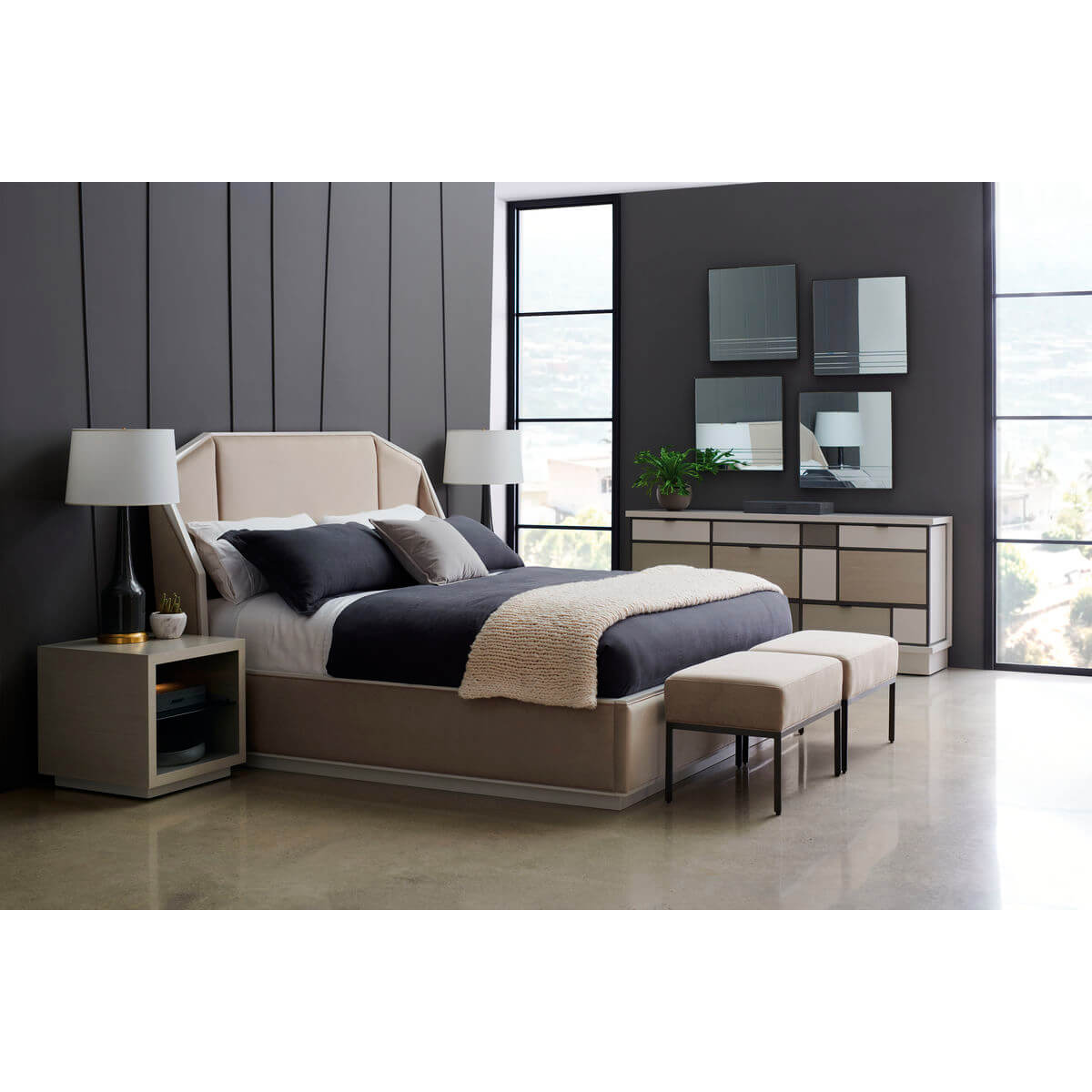 Chic bedroom setup with two benches, large windows.